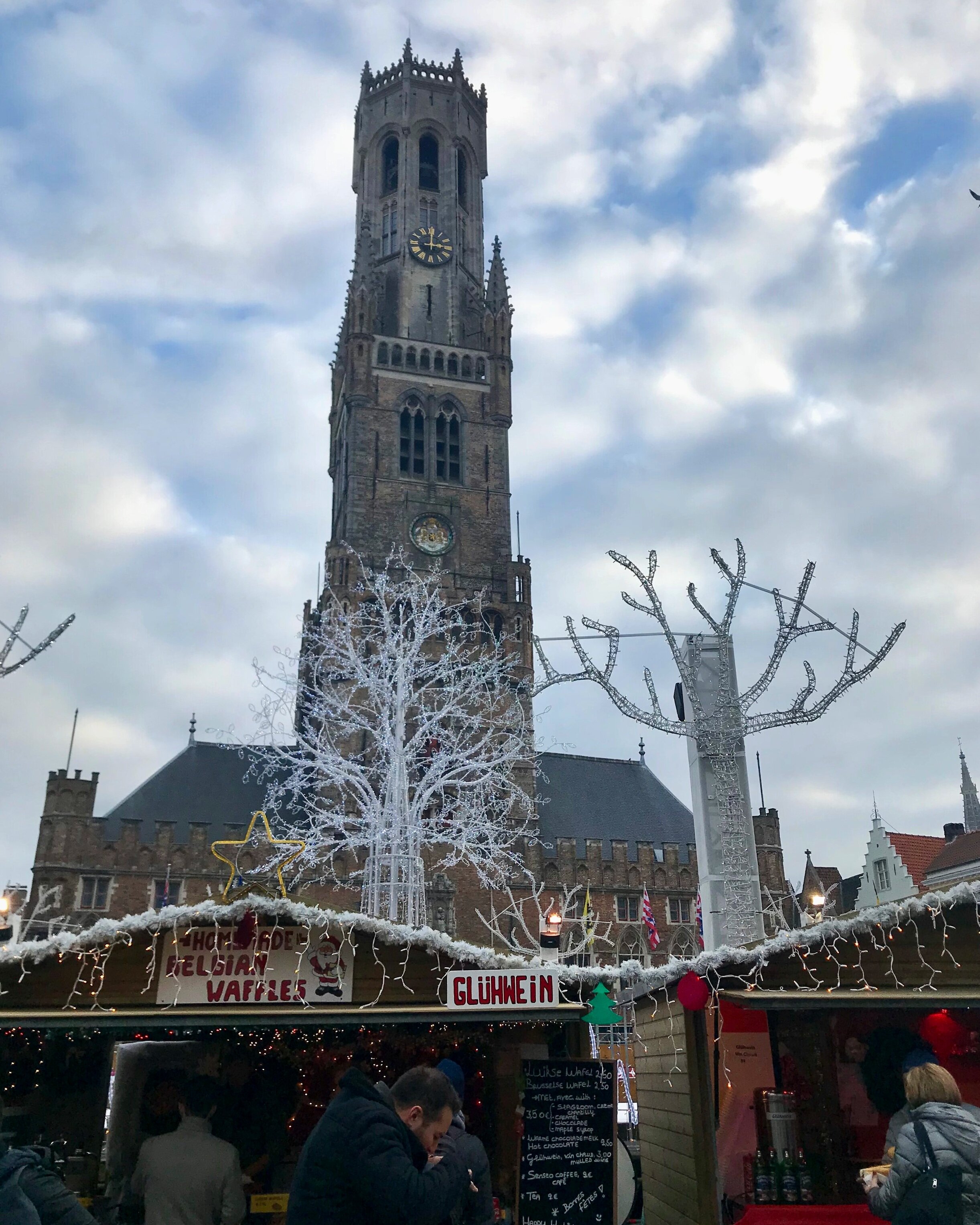 The Belfry of Brugges towers over the Christmas market in Brugges.