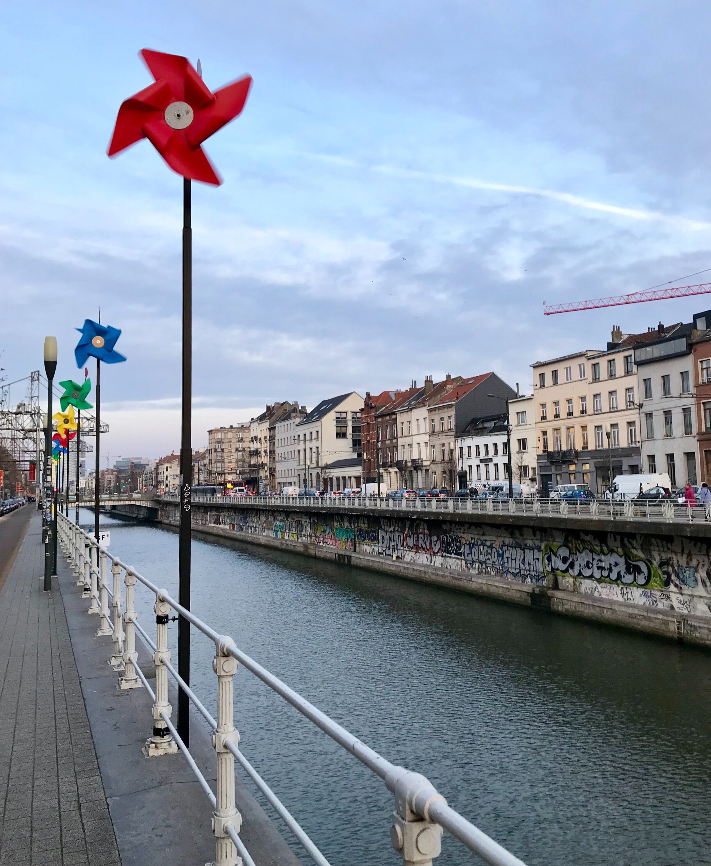 The canal through Brussels is beautiful and I love the pinwheels along the water! 