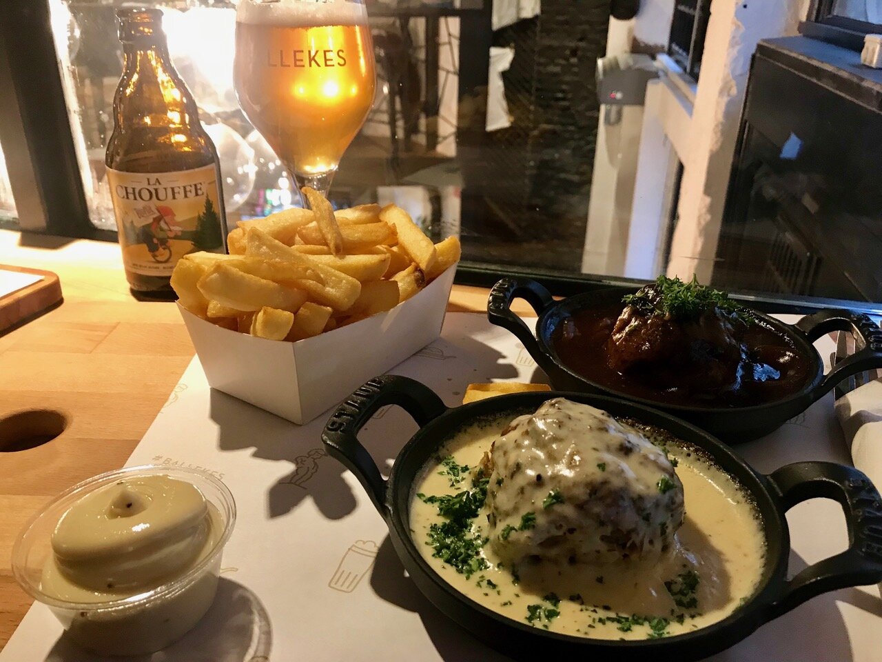 Hearty Belgian Meatballs with rich sauces and classic Belgian Frites 