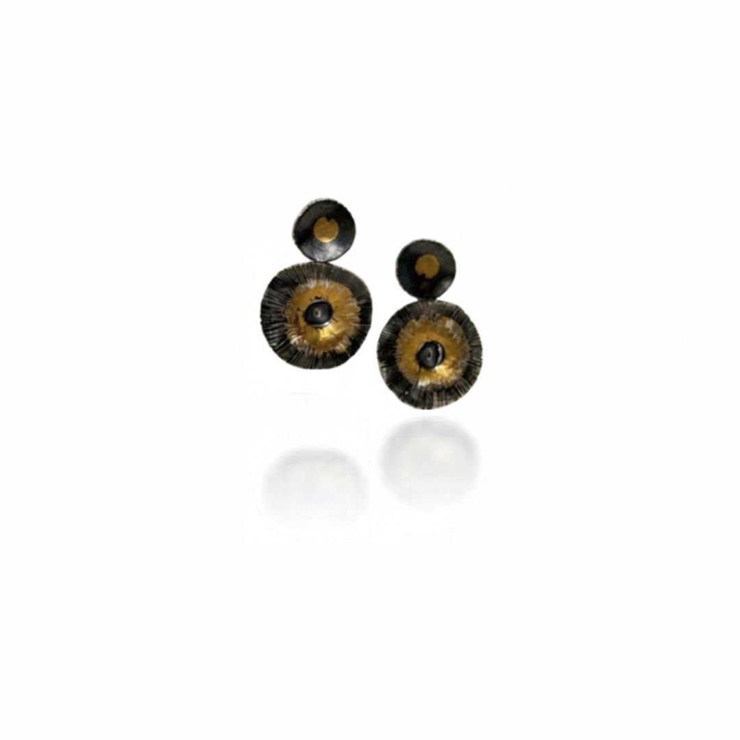 Echo Earrings, a pair of oxidized silver circle earrings with gold keum-boo accents