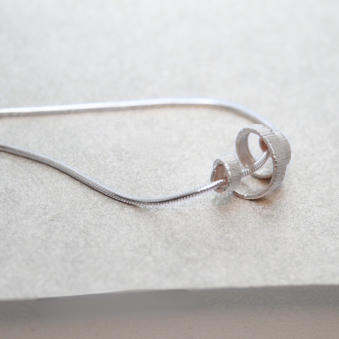 Close up of the Sterling SIlver Spiral Necklace - 3.png