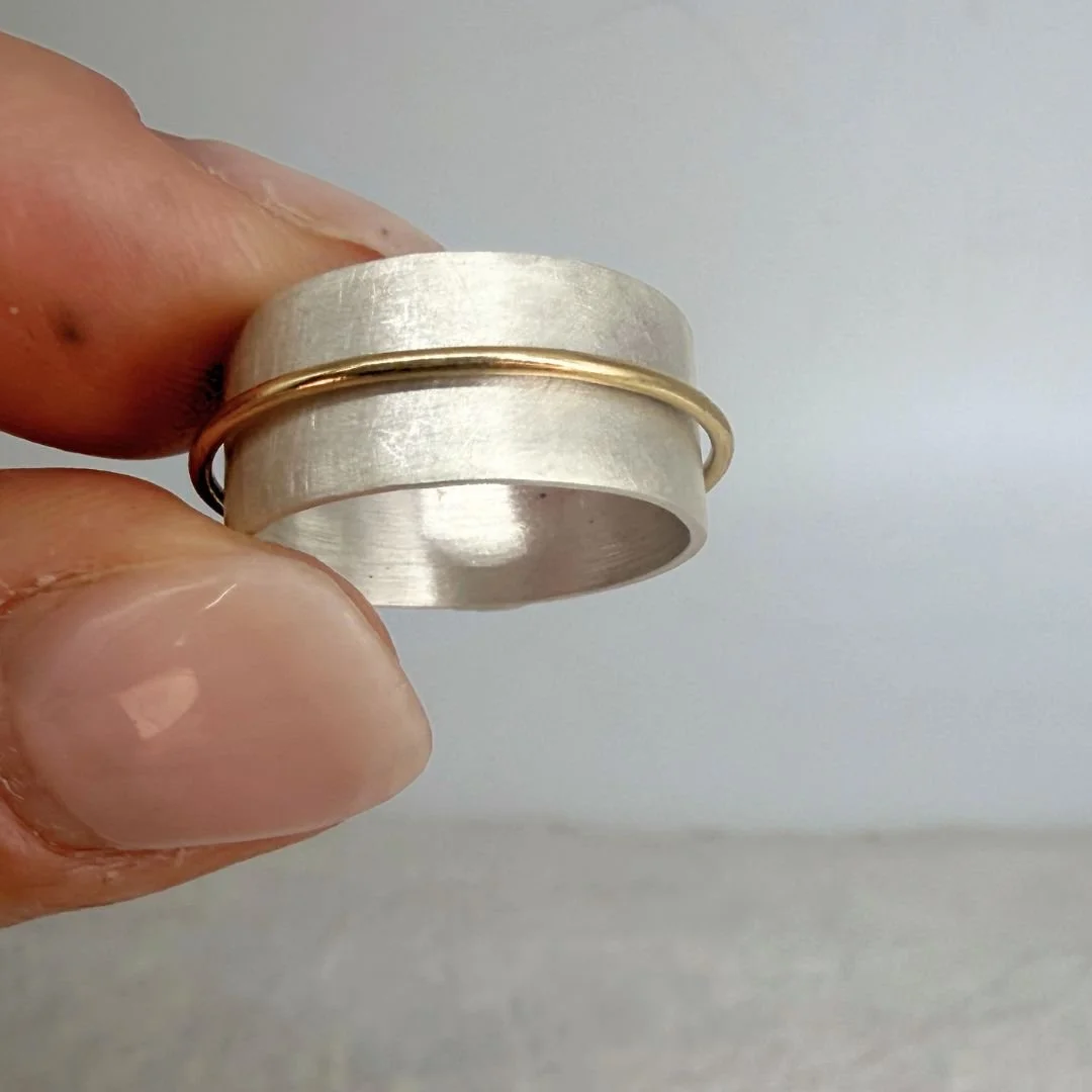 Wide band Silver ring with gold pitch photo.jpg