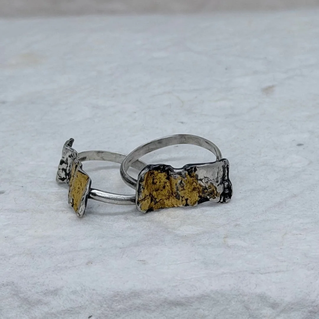 Front and side views of Petite Textured Rings, showing the narrow silver bands and textured gold and silver tops