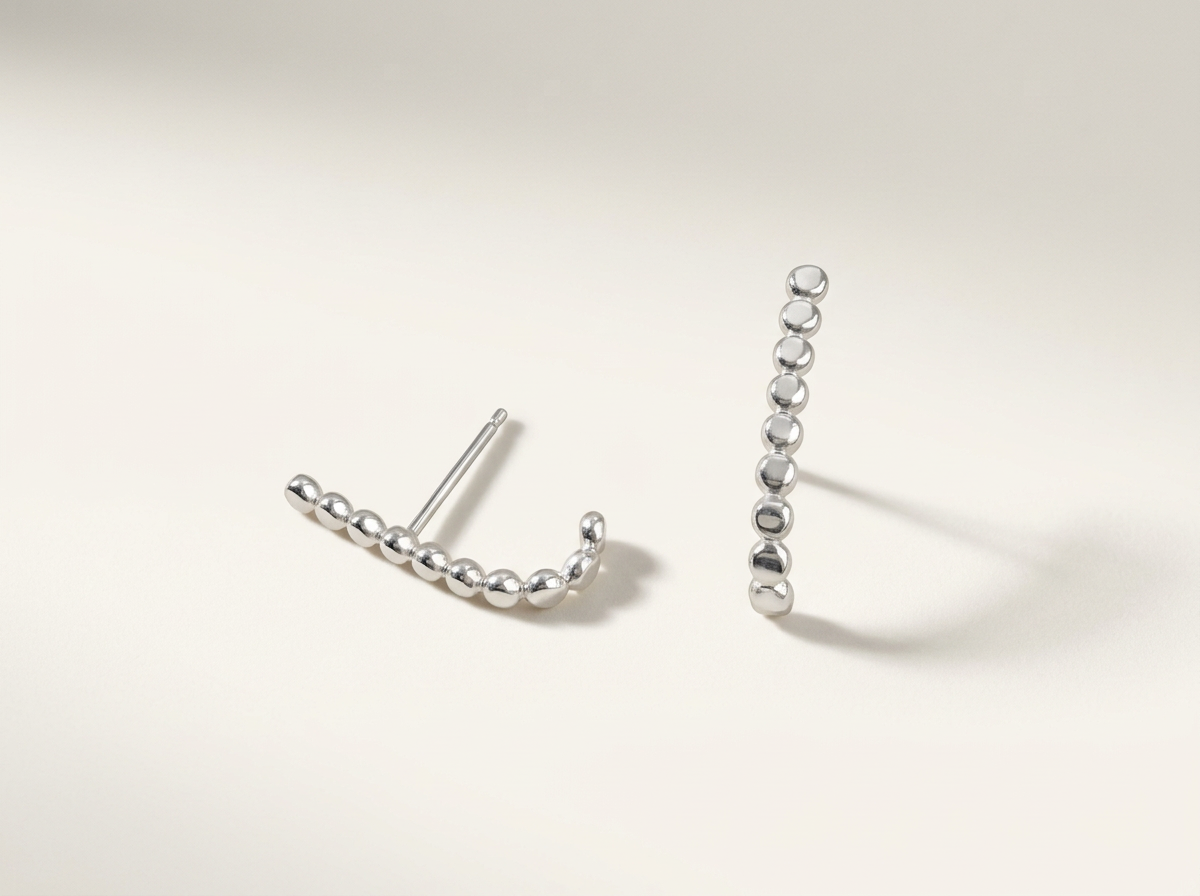 Front and side views of sterling silver half hoop earrings