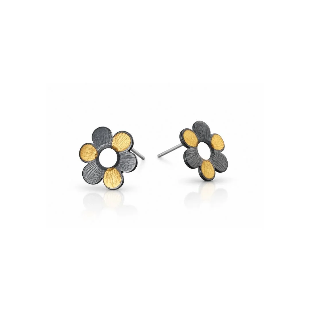 Daisy-shaped stud earrings in oxidized sterling silver with gold keum-boo accents on a white background.