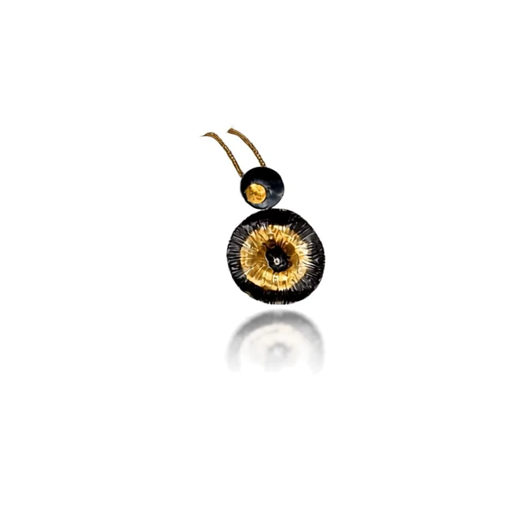 Echo mixed metal pendant in oxidized sterling silver and gold