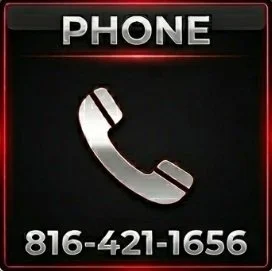 A black sign with a white telephone icon and the word 'PHONE' at the top, displaying the phone number 816-421-1656.