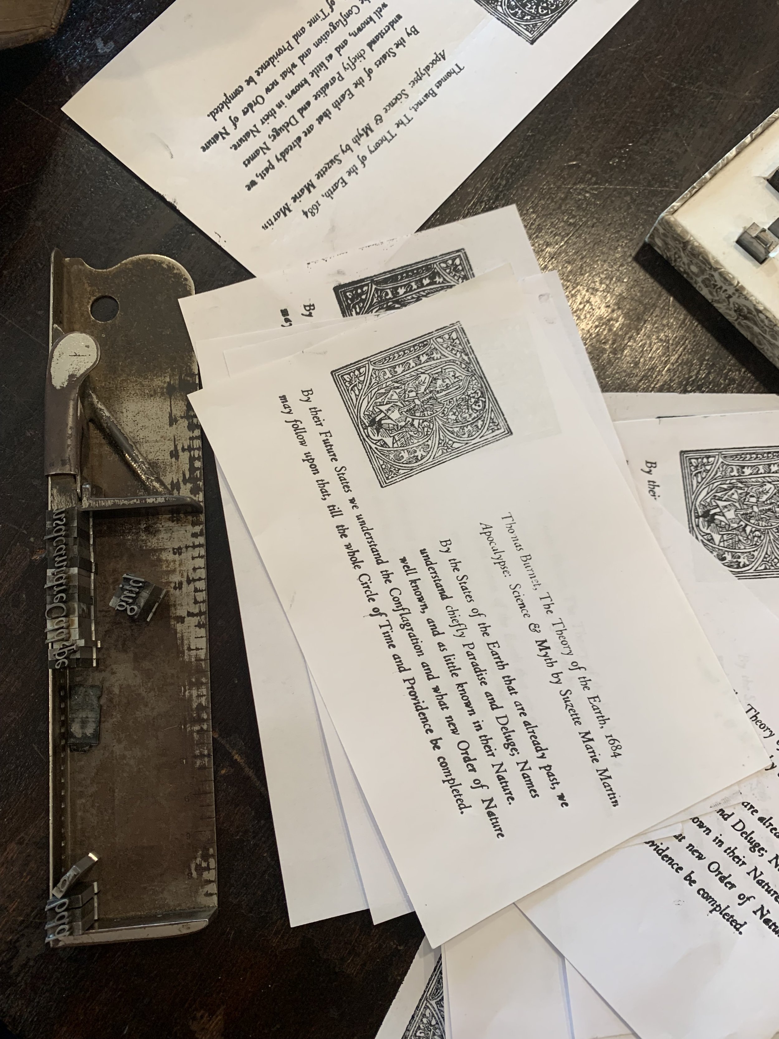 Visitors to the exhibit opening gained hands-on experience using the Kinney Center’s 20th Century acorn press to print an excerpt from Burnet’s Sacred Theory of the Earth .