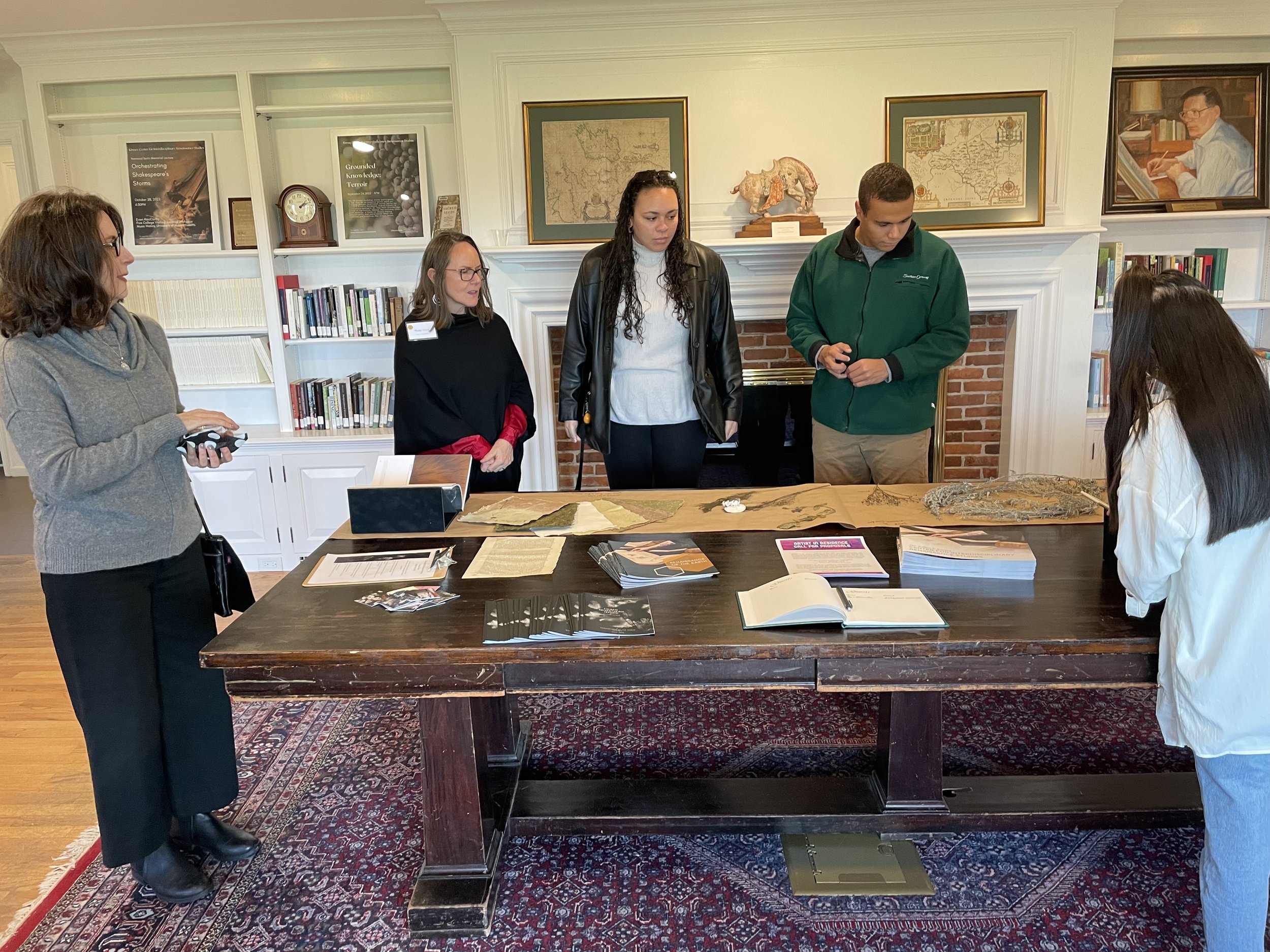 Guests to Madge’s exhibit learn about her cyanotype and mushroom spore printing process.