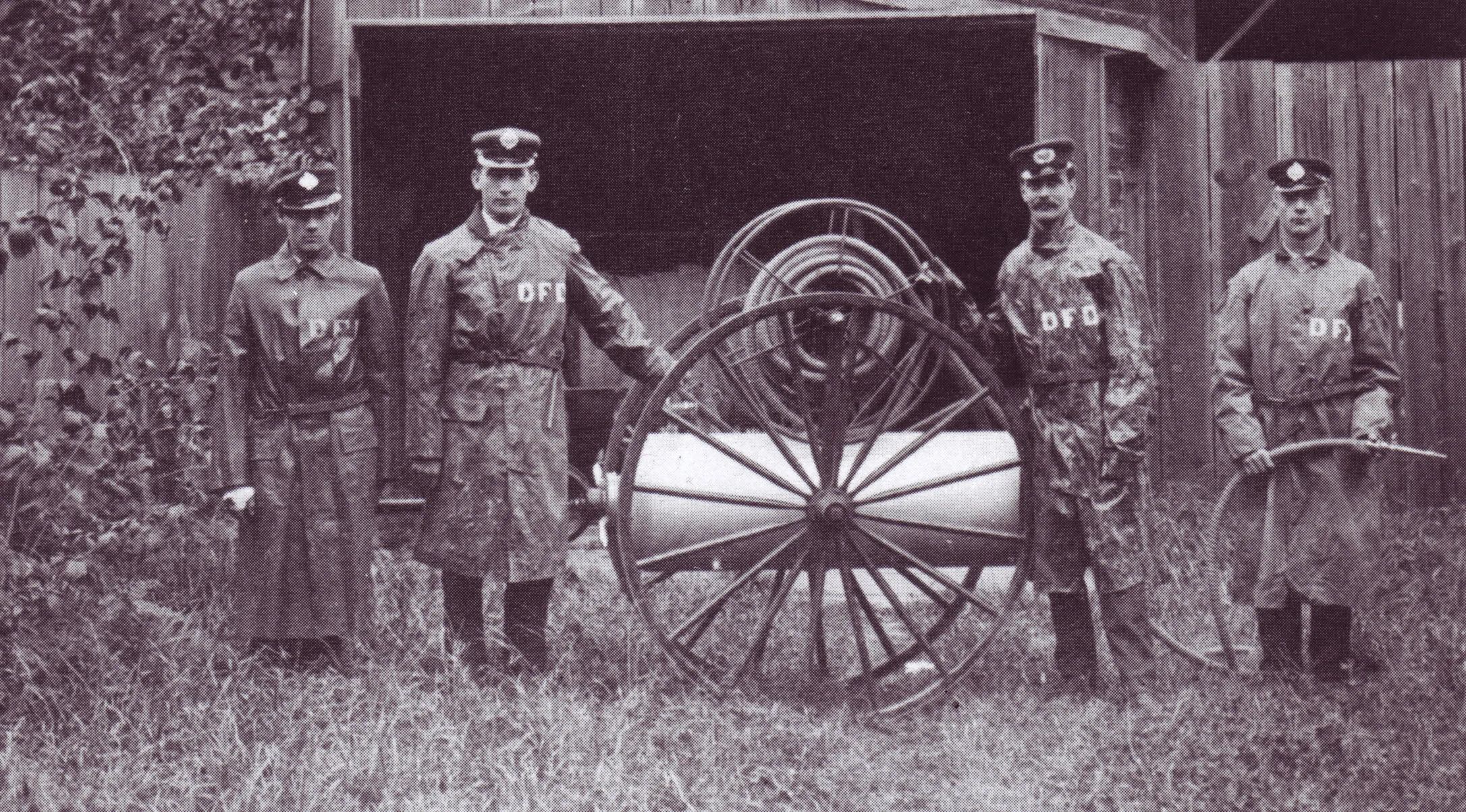 Members of the Duncan Volunteer Fire Department pose with the mobile  chemical fire extinguisher which the City of Duncan donated to the  King's Daughters Hospital.