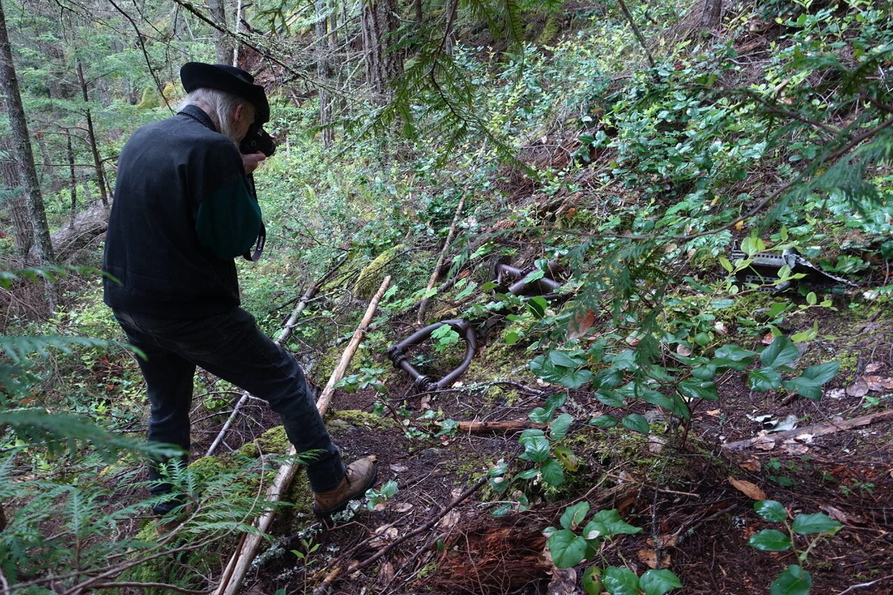 TW taking a photo of some of the Canso wreckage on Mount Benson.