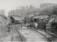 Today, this view of the busy Lenora Mine and the start of the Lenora Mount Sicker Railway looks like a gravel pit with a creek running through it. —Elwood White photo