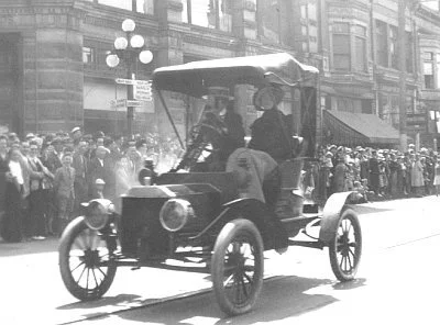 Left: The model N Ford in a parade when Phil Foster owned it.  Right: Vern Wellburn driving the 1911 Stanley on tour.  —Both photos: http://antique.vccc.com/pioneers/wellburn/wellburn.html
