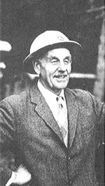 Gerry Wellburn wearing his logger’s hard hat and as stamp collector extraordinaire. —Canadian Philatelist  http://antique.vccc.com/pioneers/wellburn/wellburn.html