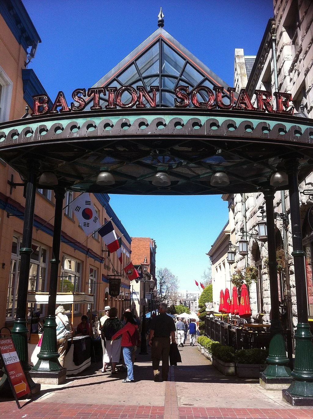 Today’s entrance to Bastion Square is very close to where the Coplands had their home and the adjacent store whose fence, they believed, encroached on their lot by all of three inches. —By bynyalcin, CC BY 3.0, https://commons.wikimedia.org/w/index.…