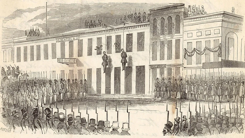 Charles Cora and James Casey hang from this makeshift gallows, 1856. —Wikipedia. By Huestis, Charles B. (active ca. 1856-ca. 1859), artist Town Talk, printer - http://content.cdlib.org/ark:/13030/tf229007rh/?layout=metadata, Public Domain, https://commons.wikimedia.org/w/index.php?curid=242284