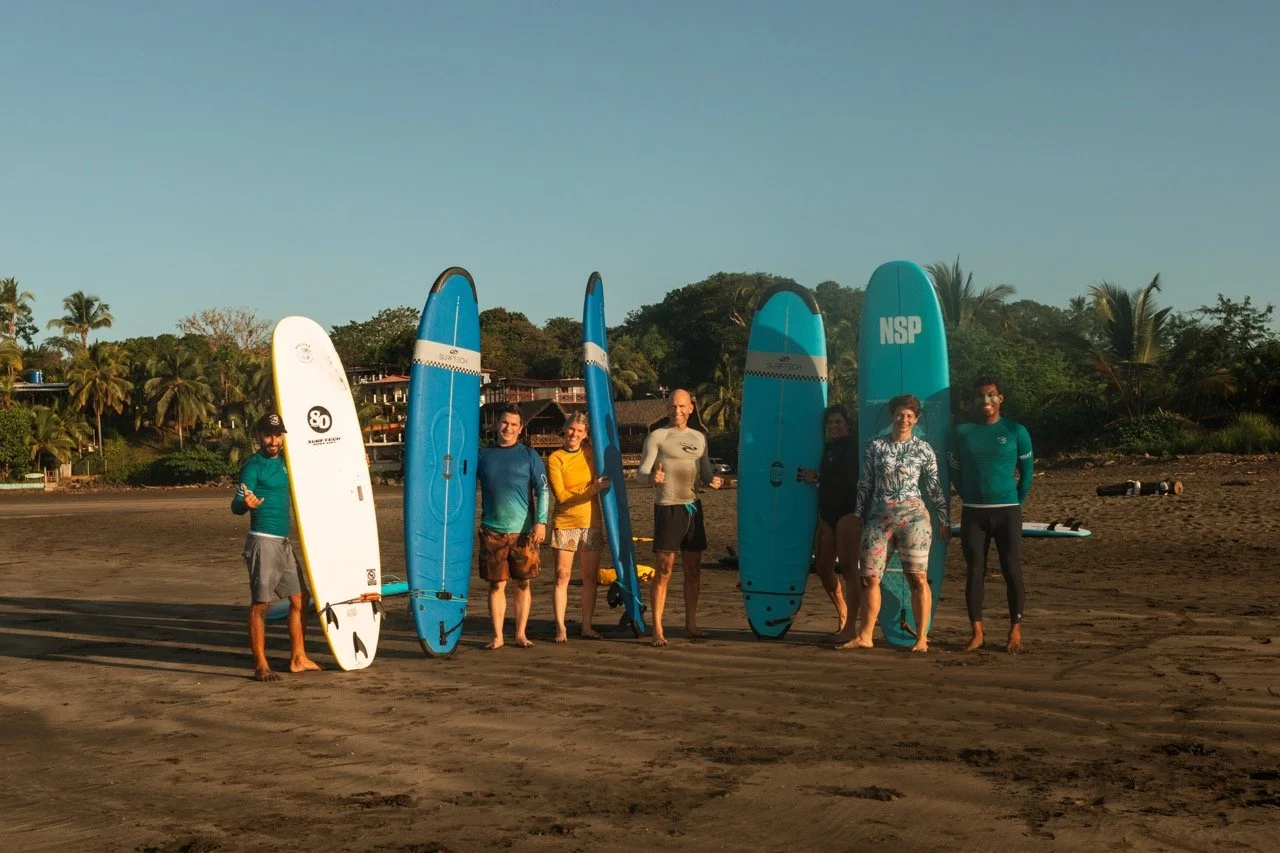 5 Reasons to Join a Surf Retreat (Even if You’re a Beginner) 5 A successful surf lesson at Playa Estero, Santa Catalina