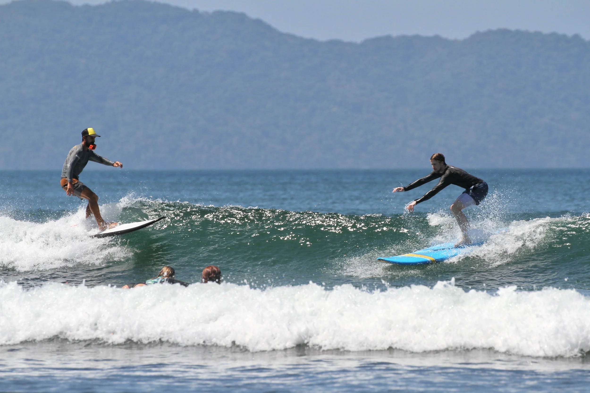 The Waluaa Guide to Surf Etiquette & Navigating the Lineup 3 guy surfing and dropping in