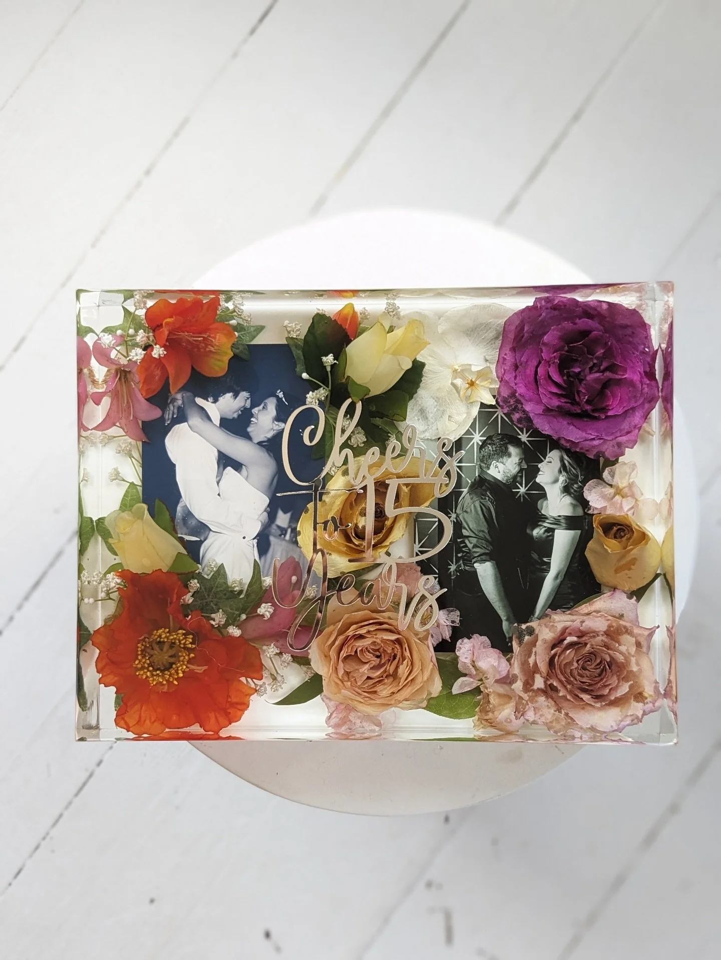 One resin piece, two chapters of their love story! 

Wedding-day silk florals paired with real blooms from their anniversary celebration&mdash;preserved together to honor memories that span the years.