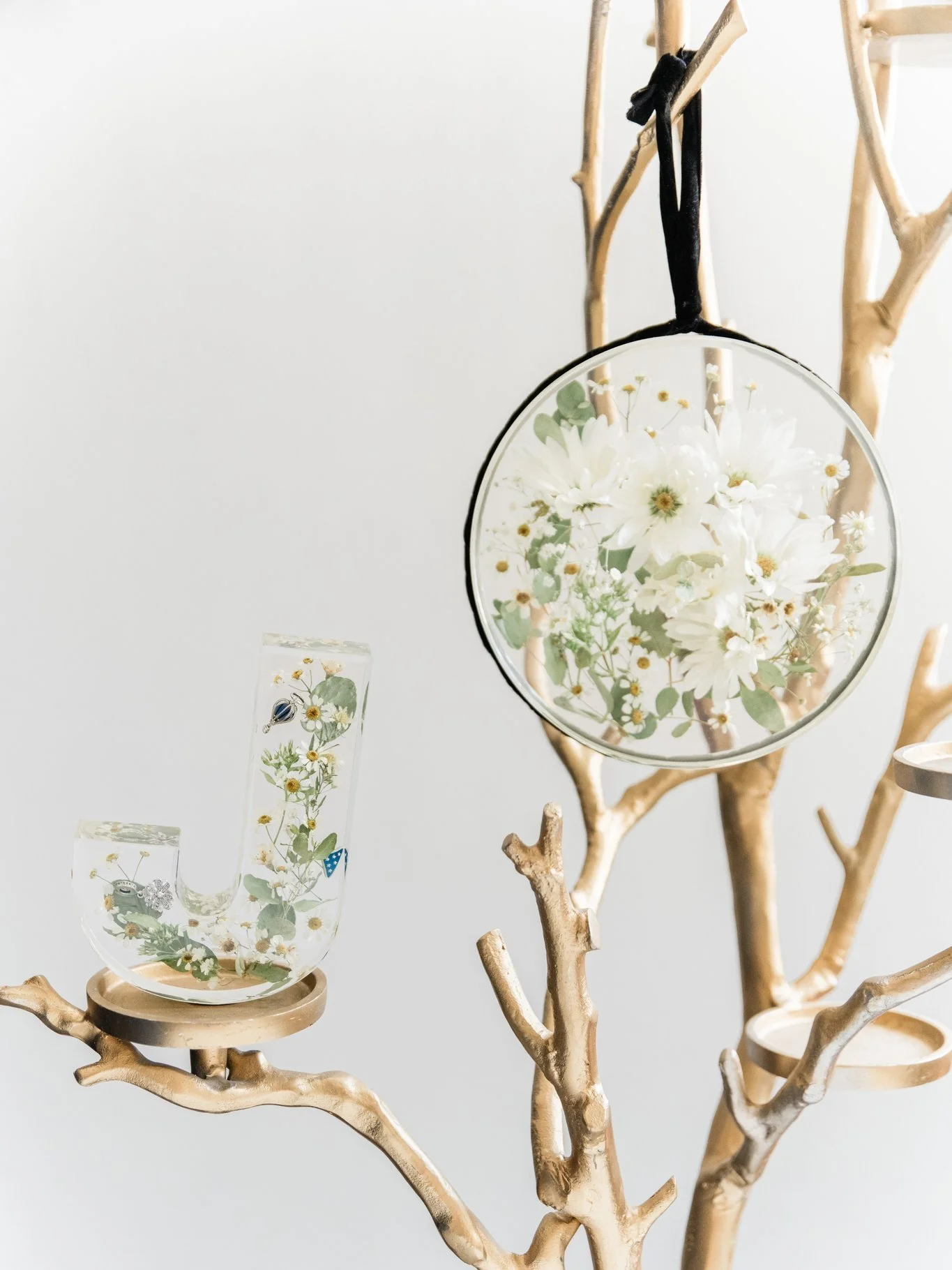 Did you include charms on your bouquet or maybe even a special tie pin or clip? 

This resin keepsake was created with charms from the bridal bouquet, preserving the love carried down the aisle forever. 

Tie pins, clips, and other meaningful pieces 