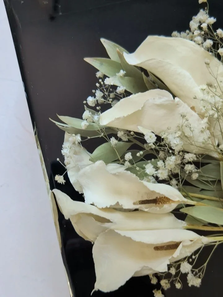 When our client came to us with this idea, we couldn&rsquo;t say &lsquo;yes&rsquo; fast enough! 
This piece is everything! The dark, black background with the crisp, white callas and the touch of greenery&hellip; she&rsquo;s a beaut!