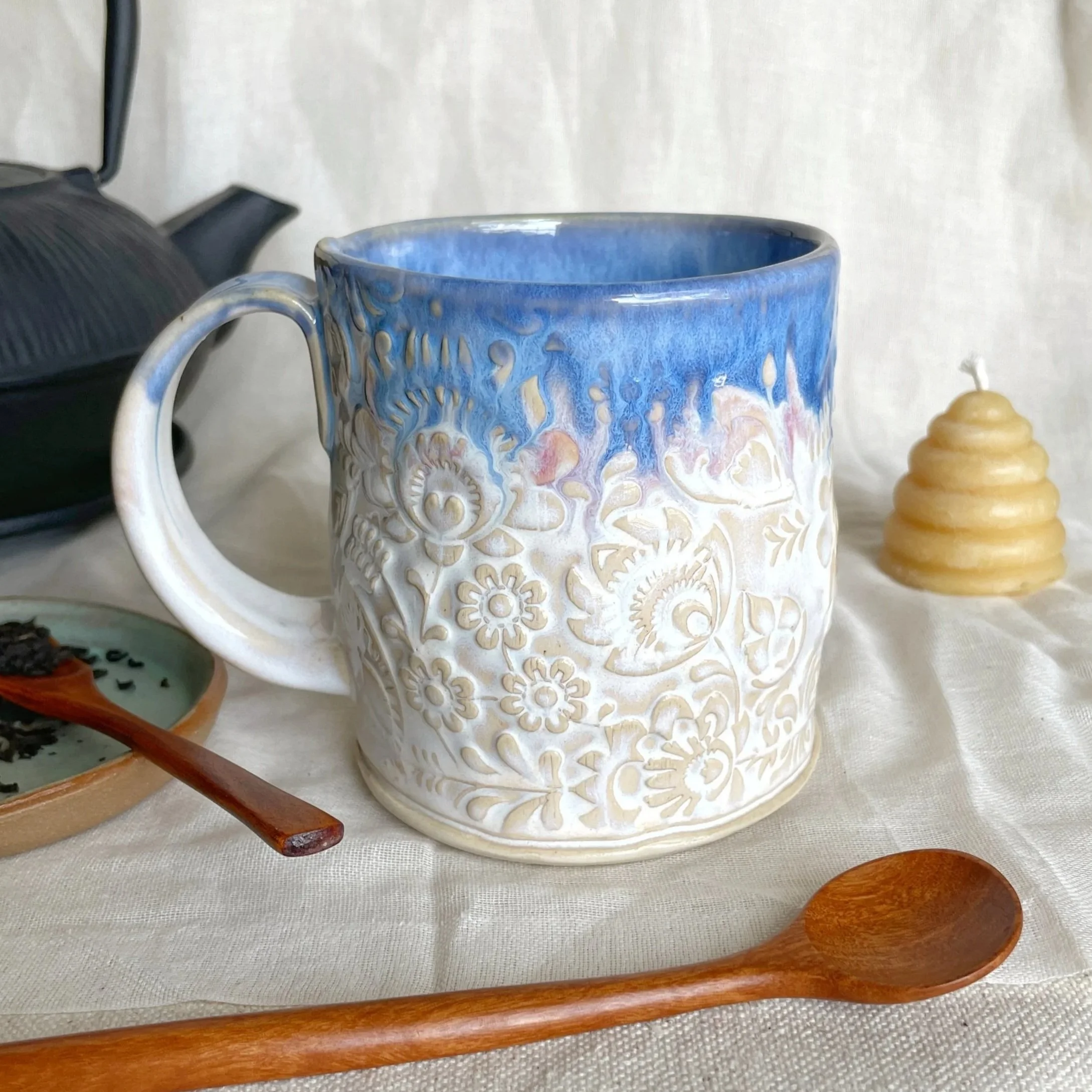 Folk Art Embossed 15.25 oz Curvy Handmade Pottery Mug - Winter White and Blue