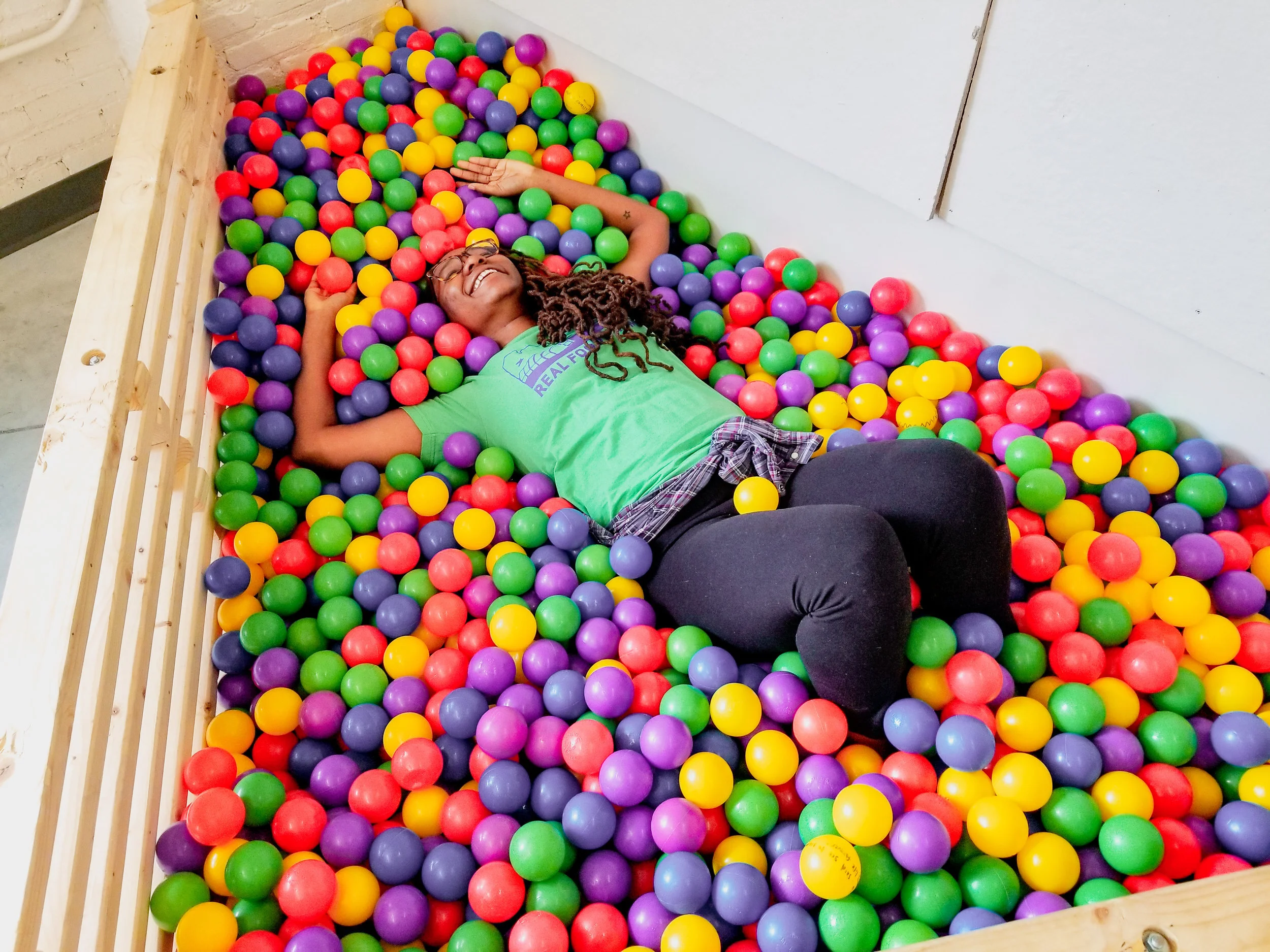 Design for the Wellbeing of Black Womxn cohort member radiating joy during a studio ideation session.