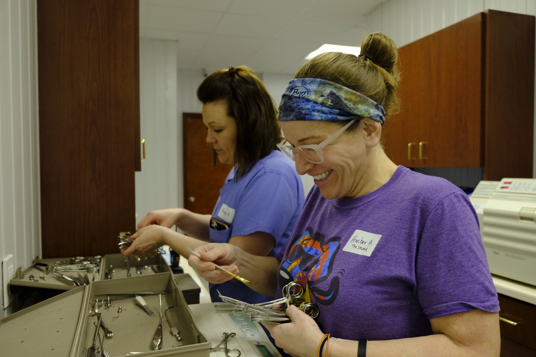  Amber Raibley ( back ) and certified surgical technologist Amber Adams ( front ) sterilizing instruments. 