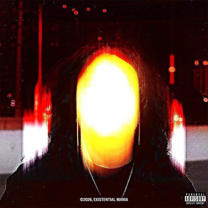 A faceless person with long hair wearing a necklace in a dimly lit environment with a bright yellow and red glow behind their face.