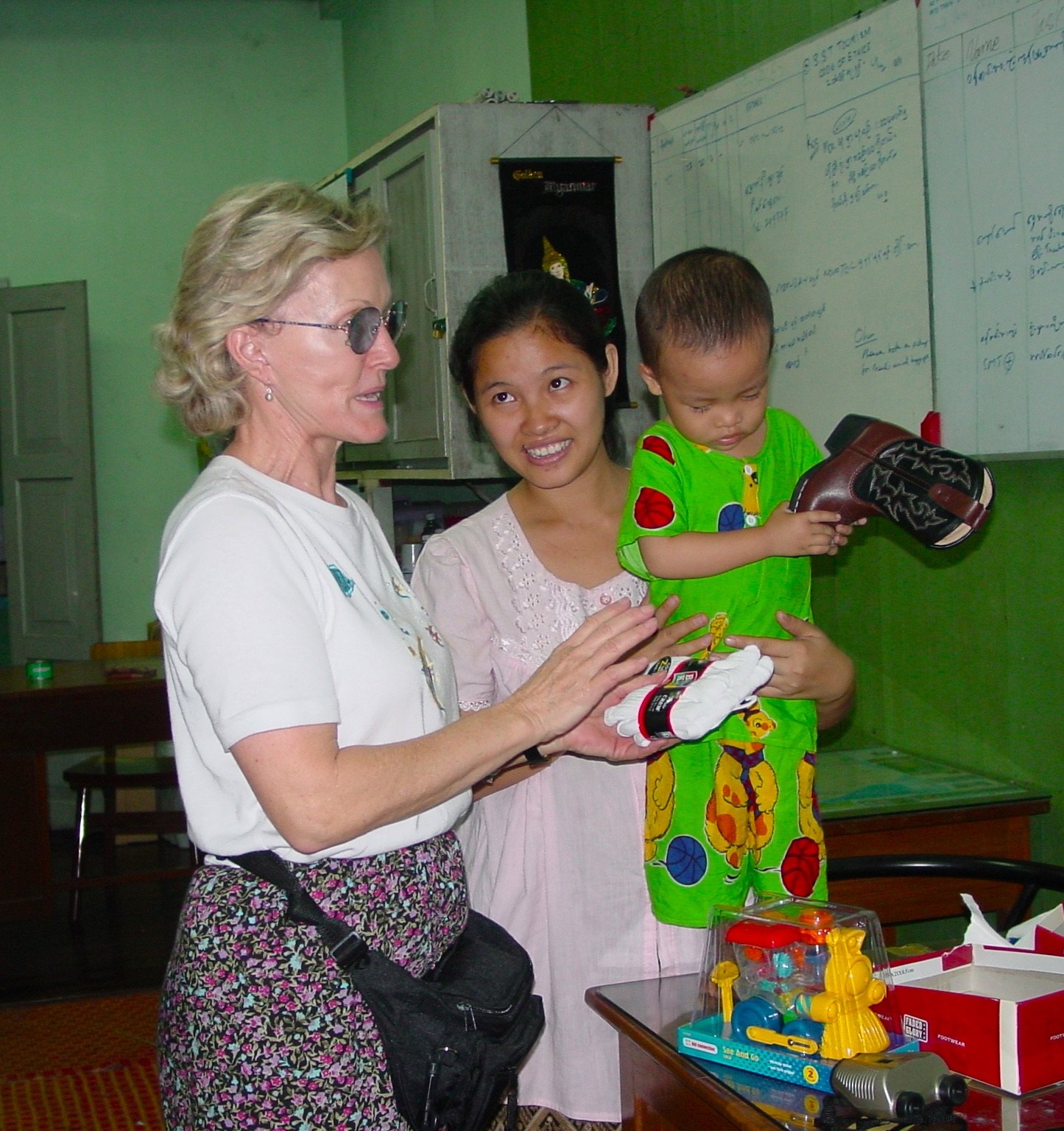 Brenda Shaddox with woman and child in Myanmar - The Explorer's Club - Corner Cartel Boerne celebrates Women's History Month