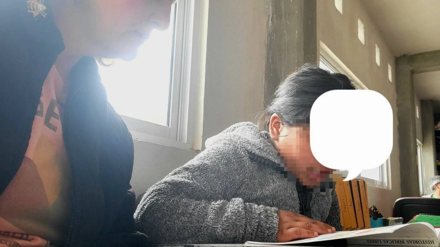 Siblings, learning to read at our school