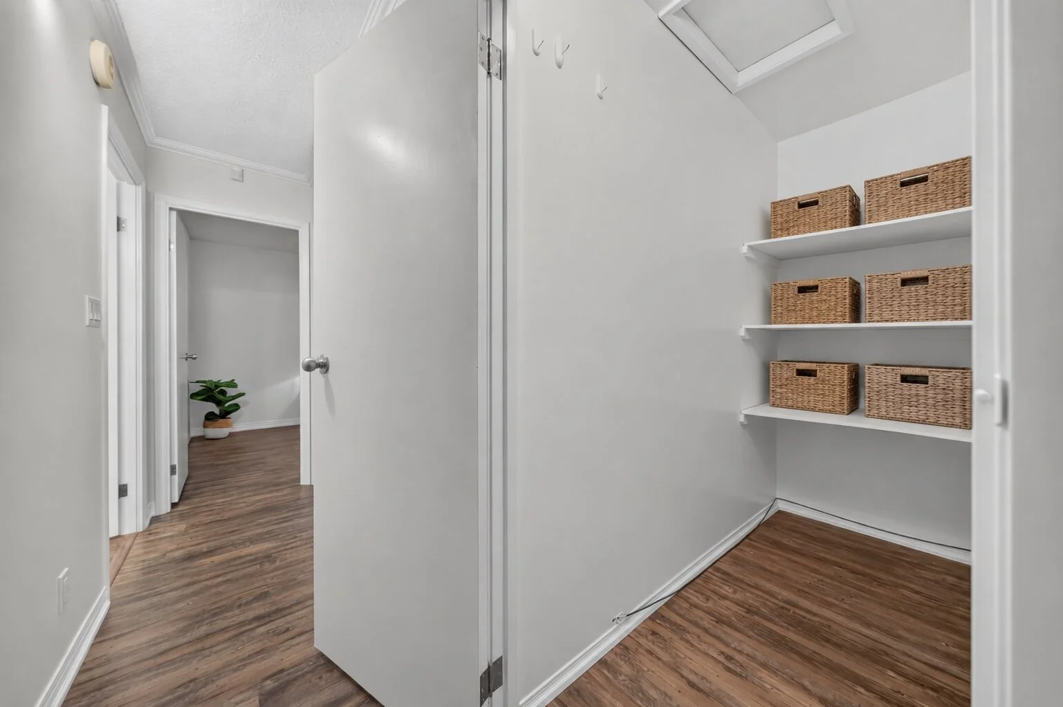 Wicker Baskets on White Closet Shelves.jpg