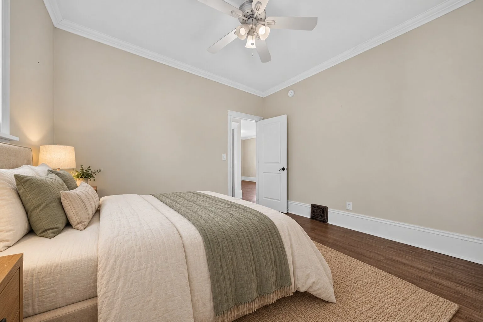 Reverse-angle bedroom with sage accents.jpg