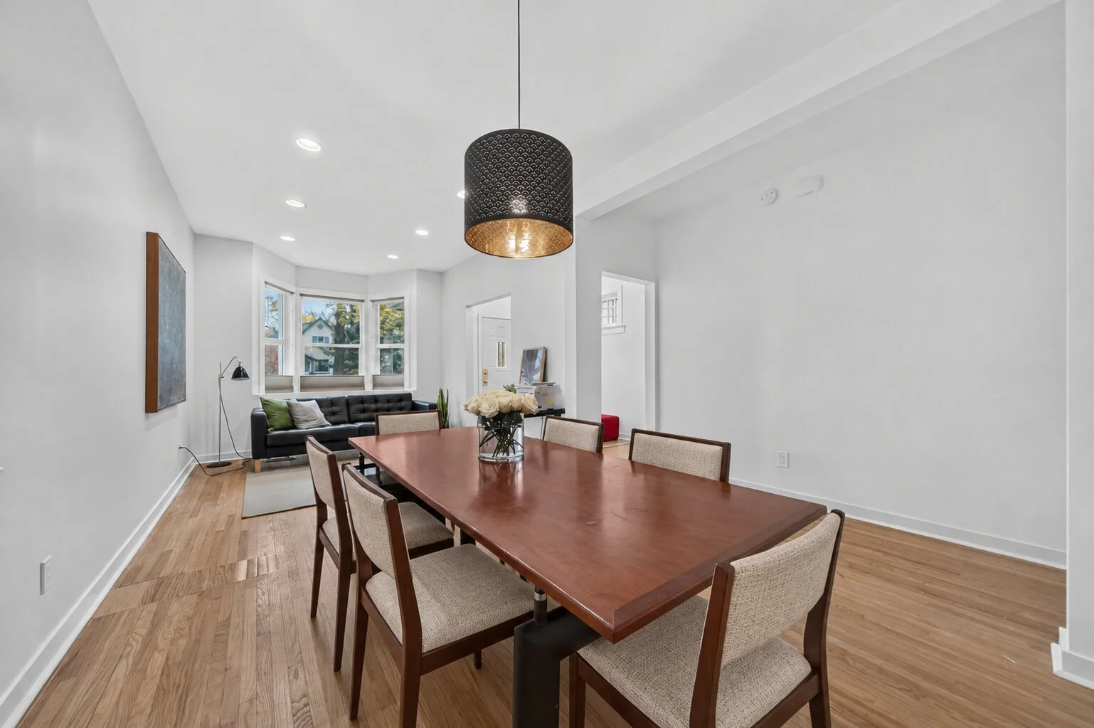Six beige chairs around dining table.jpg