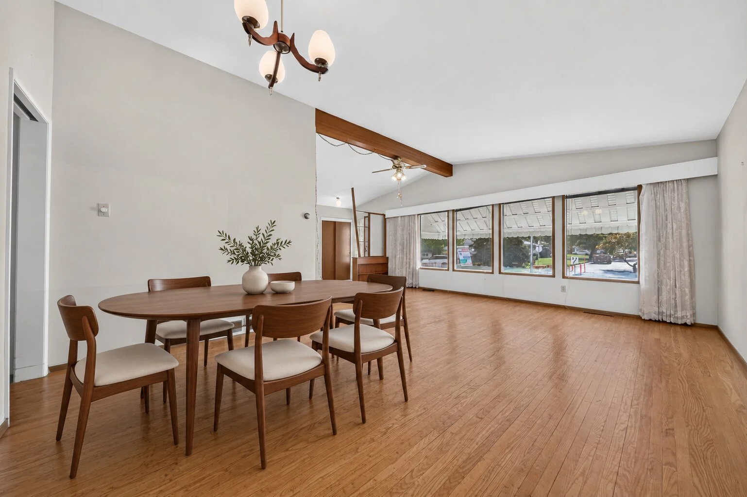 Mid-century dining set beneath chandelier.jpg