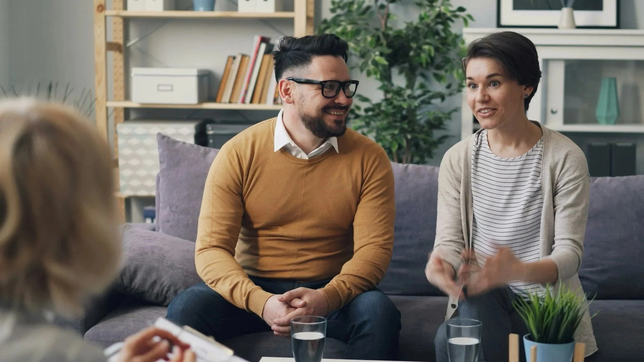 Couple engaged in a positive conversation with their therapist