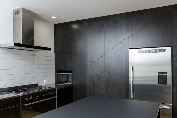 Black+plywood+kitchen+wall+and+bench.jpg