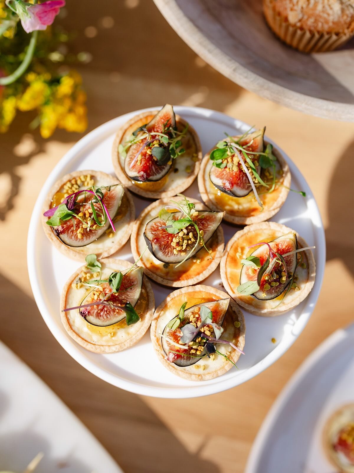 New appetizer alert 🚨 

Our feta and fig tartlets are as beautiful as they are delicious. Savory feta cheesecake filling is baked inside a savory crust, topped with fig jam, fresh fig and micro greens. The perfect savory sweet bite!

Add these littl