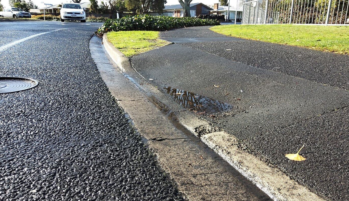 Photo of a kerb ramp close up to see detail of gradient change.