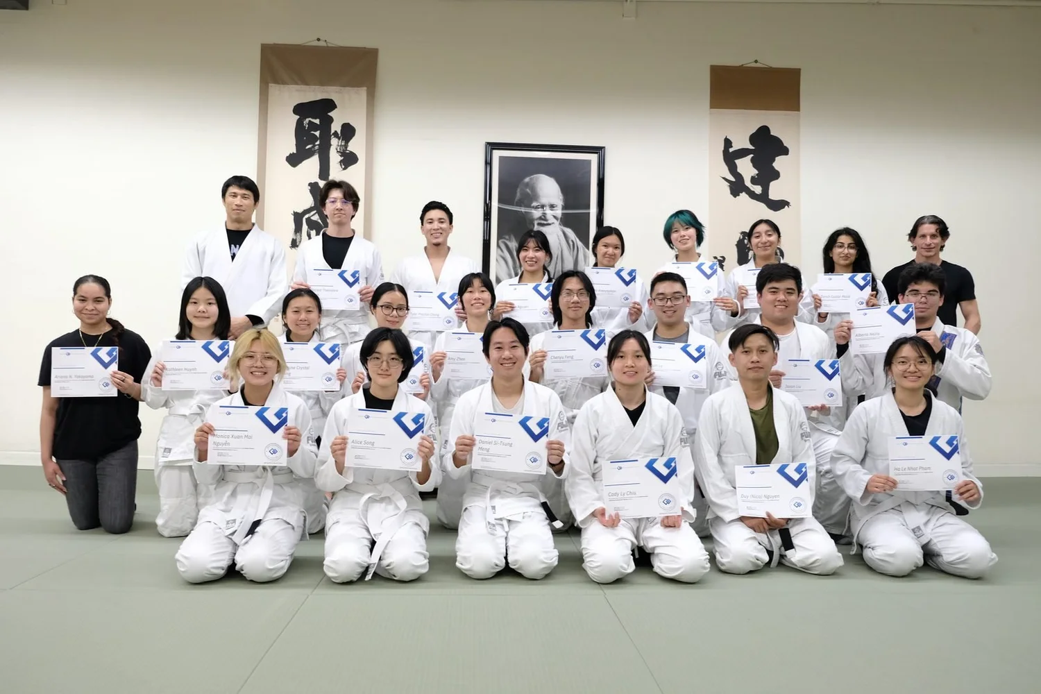 A Martial Arts and Leadership cohort with their certificates at Ikazuchi Dojo