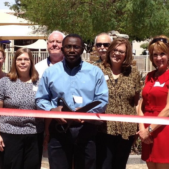 Founder, Victor Jakpor, at a ribbon cutting ceremony.