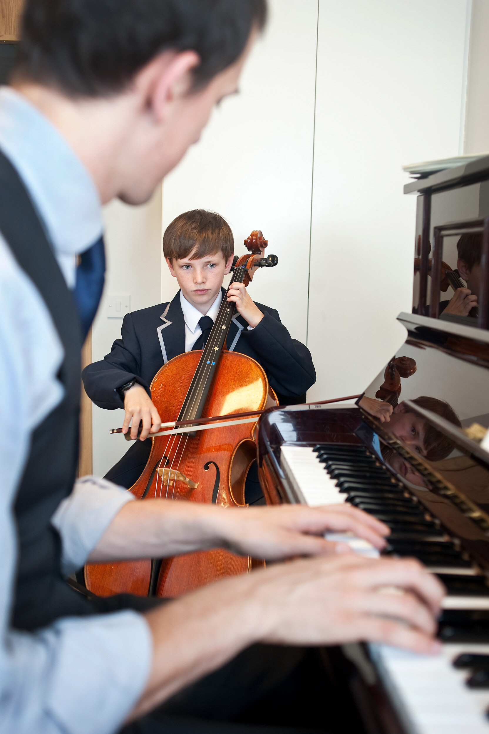  West London Free School, London W6, UK.  Cello lesson.  Shot by Eleanor Bentall, photographer. 