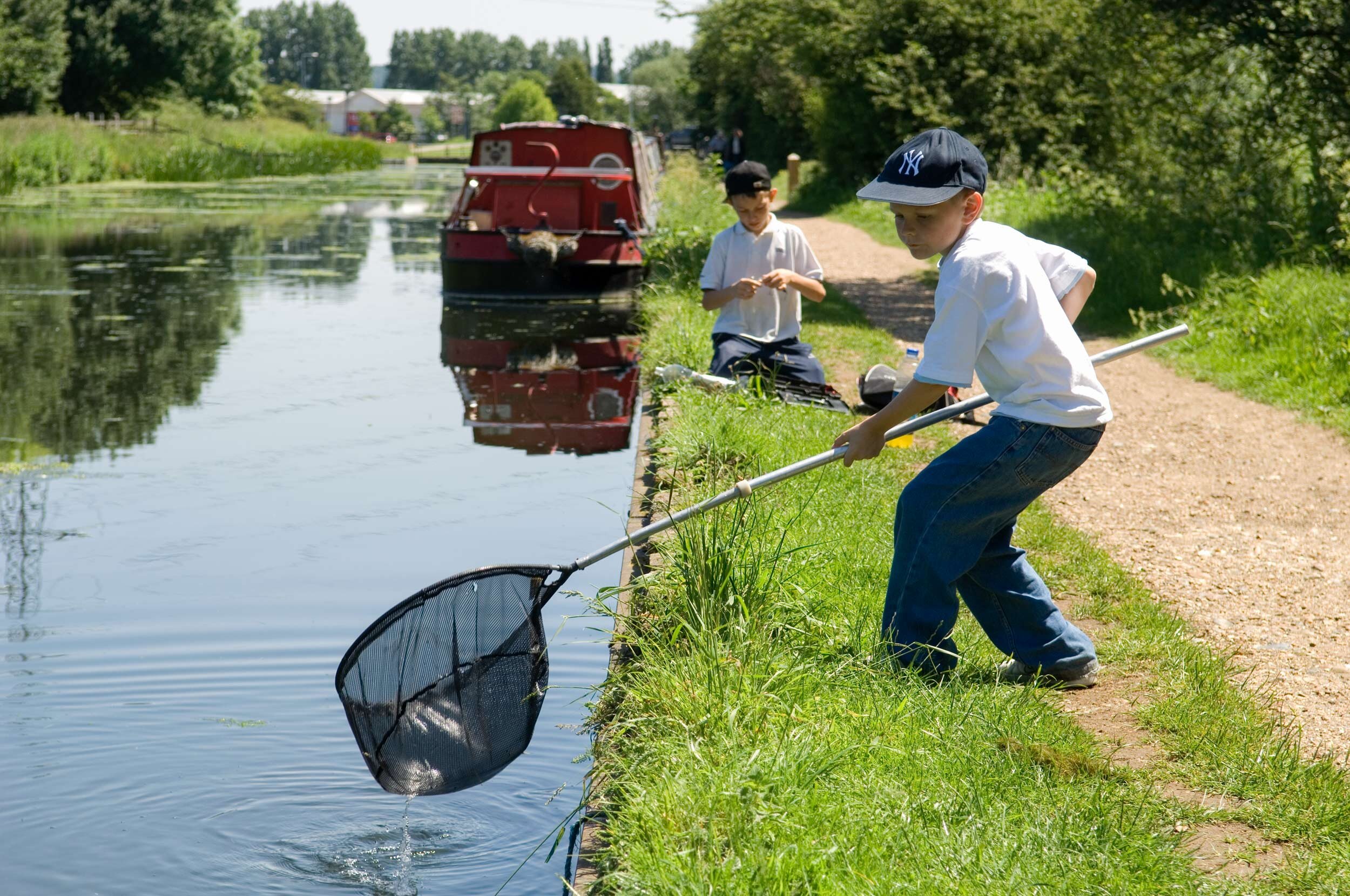  Lee Valley Park. Boys fishing, River Lee Country Park near Cheshunt.  Shot by Eleanor Bentall, photographer.  