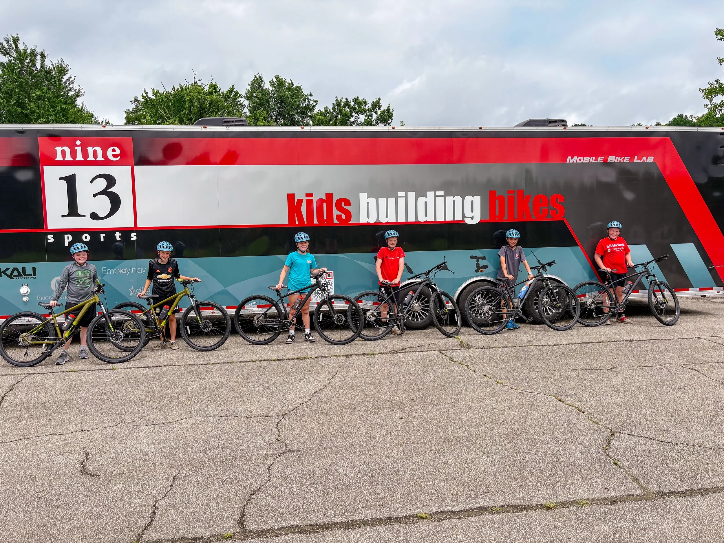 KidsBuildingBikes.jpg