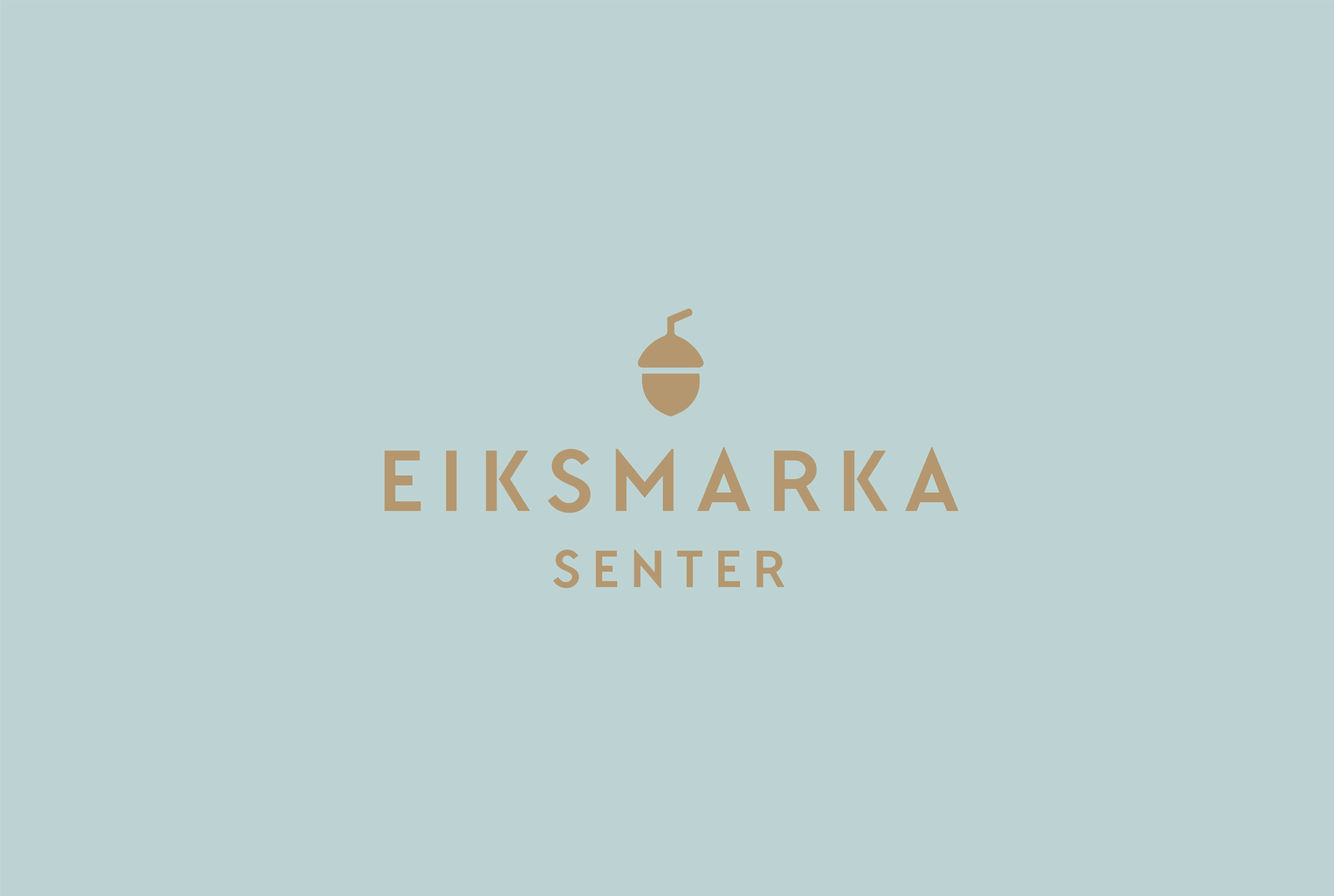 Eiksmarka senter logo med en eikenøtt over teksten
