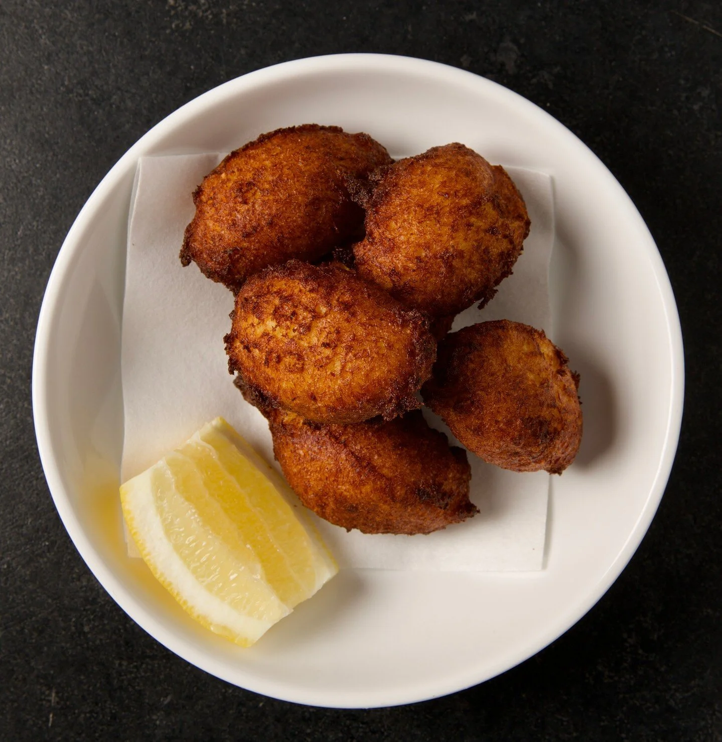 Delicate. Crispy. Savory.

What words would you use to describe our Cod Fritters?