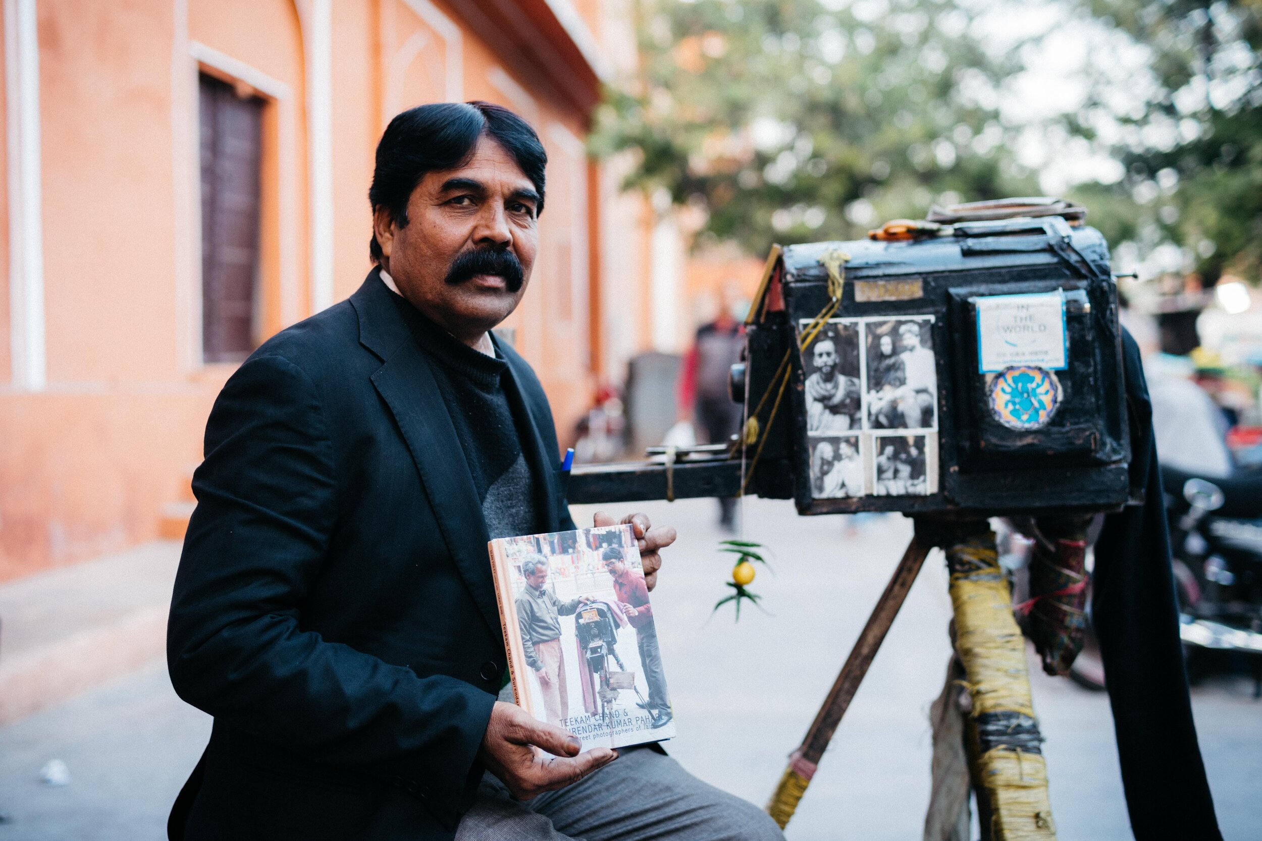  Teekam Chand with a book about him and his street photography 