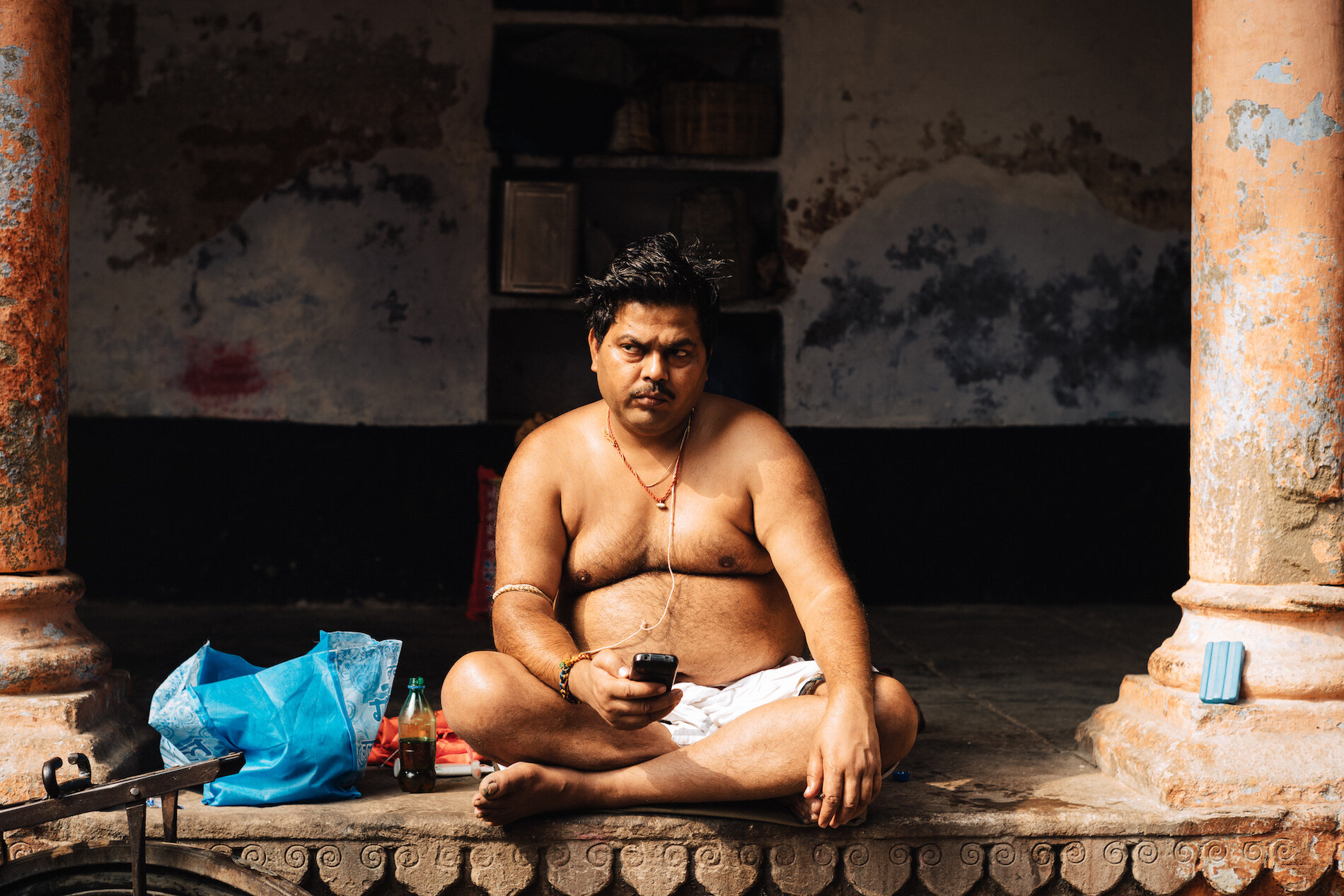  A man sitting outside a Brahman temple 