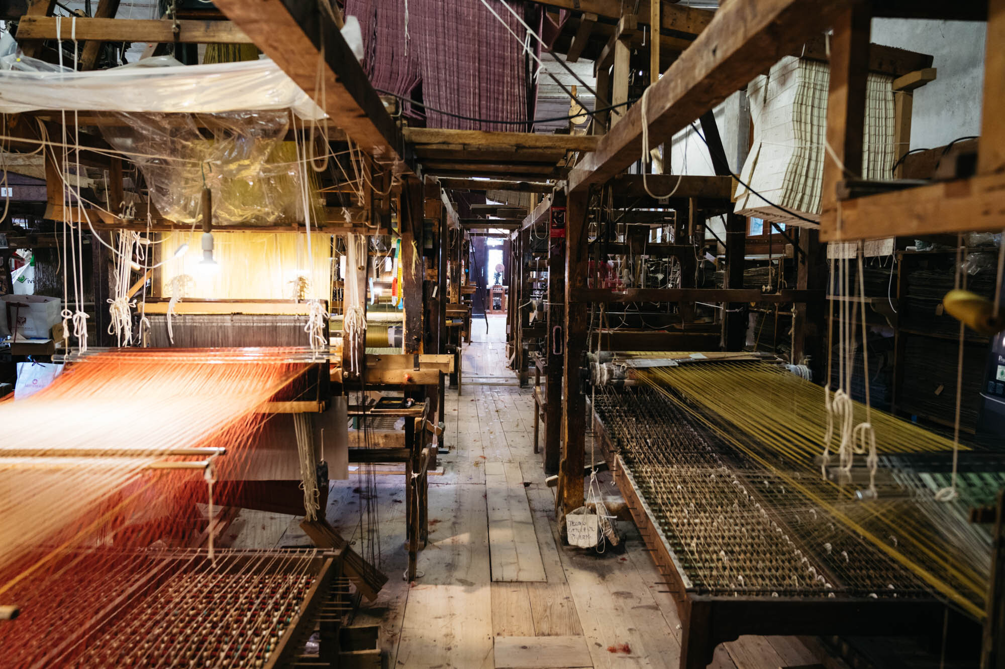  There are around 12 looms in the workshop 