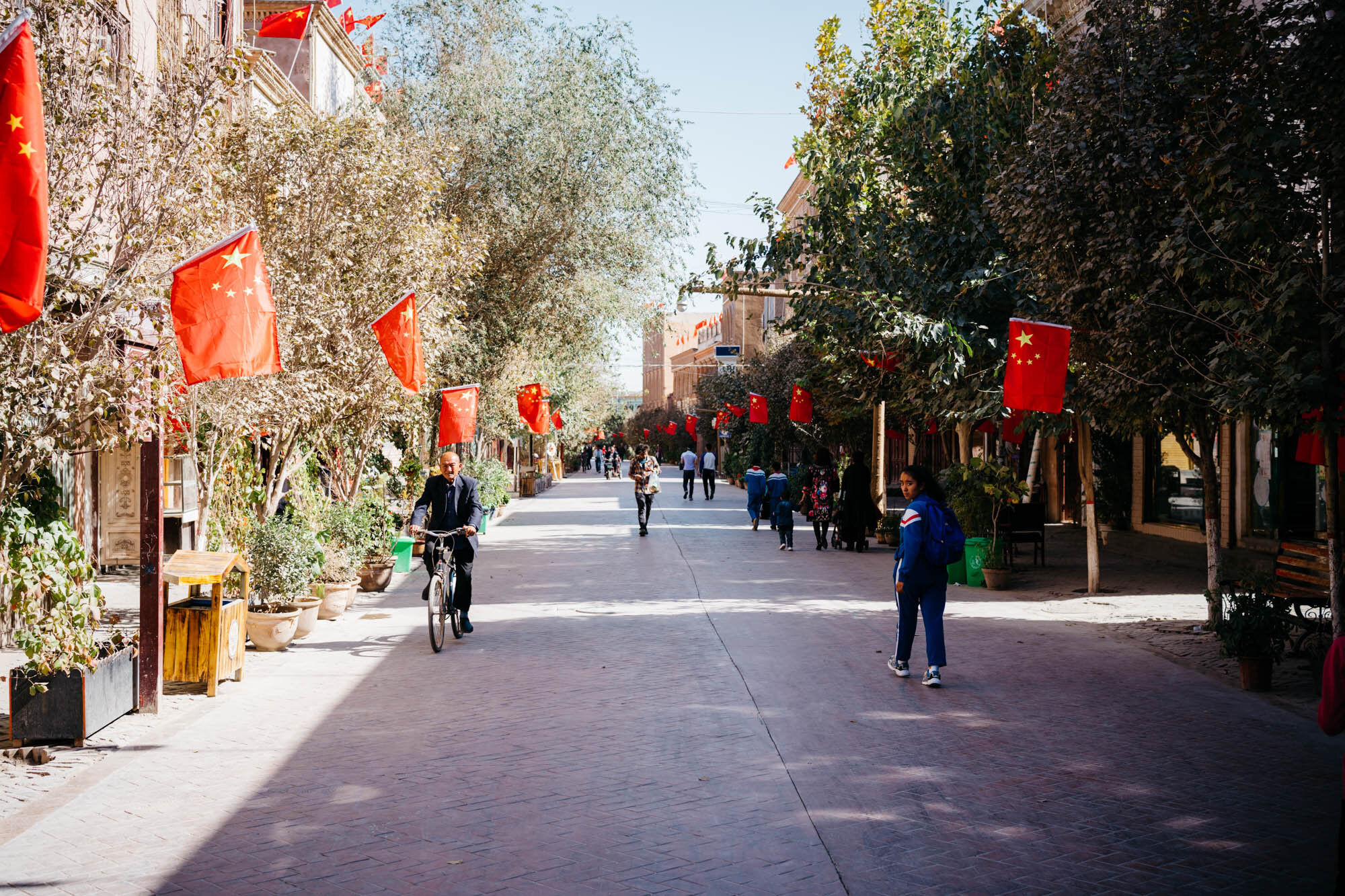  Kashgar's new 'old town'. Much of Kashgar’s original old town has been demolished in recent years in part due to poor sanitary conditions and been replaced by an ‘old style’ new old town. My visit was soon after the 70th anniversary of the People’s 
